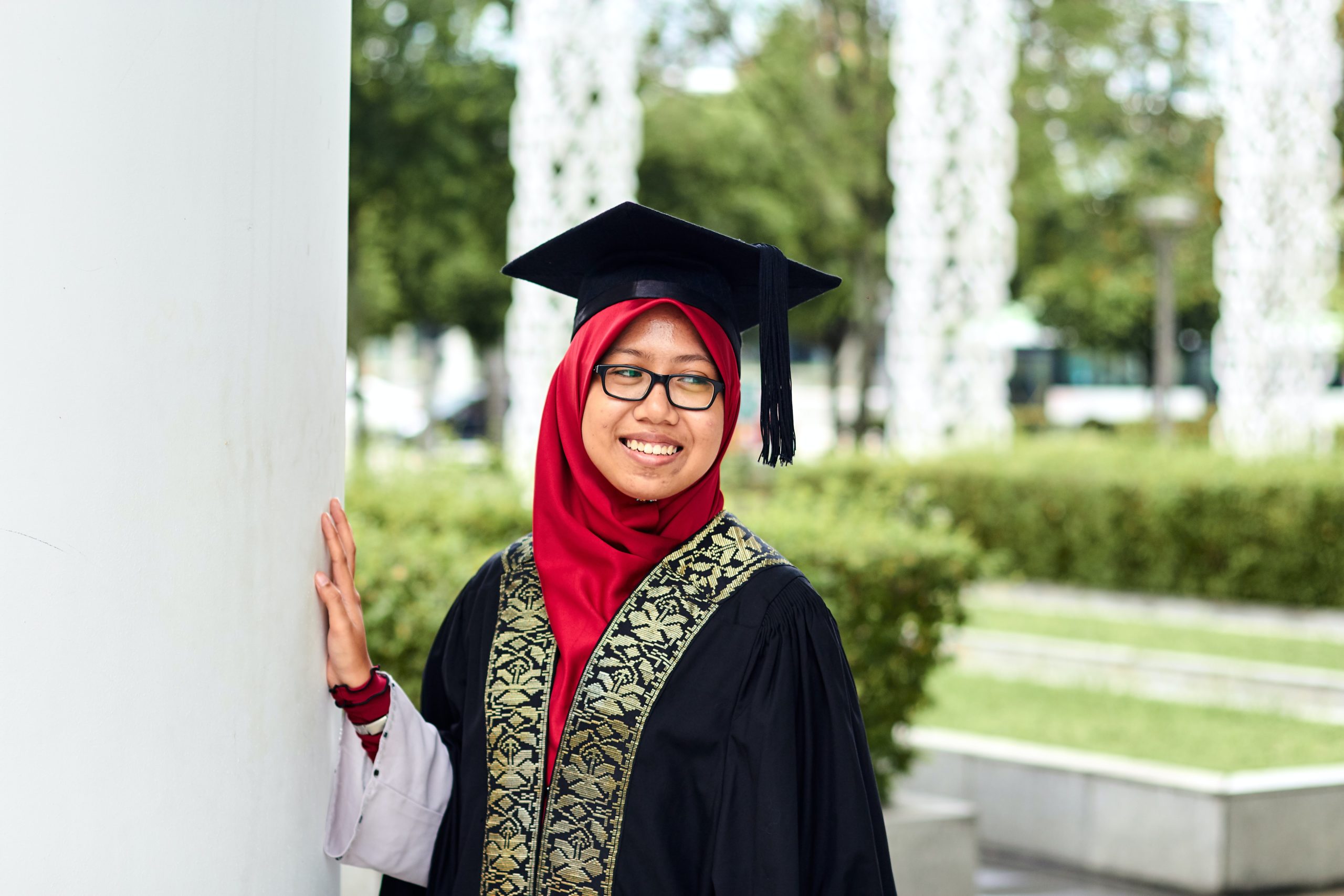 happy Muslim student graduating